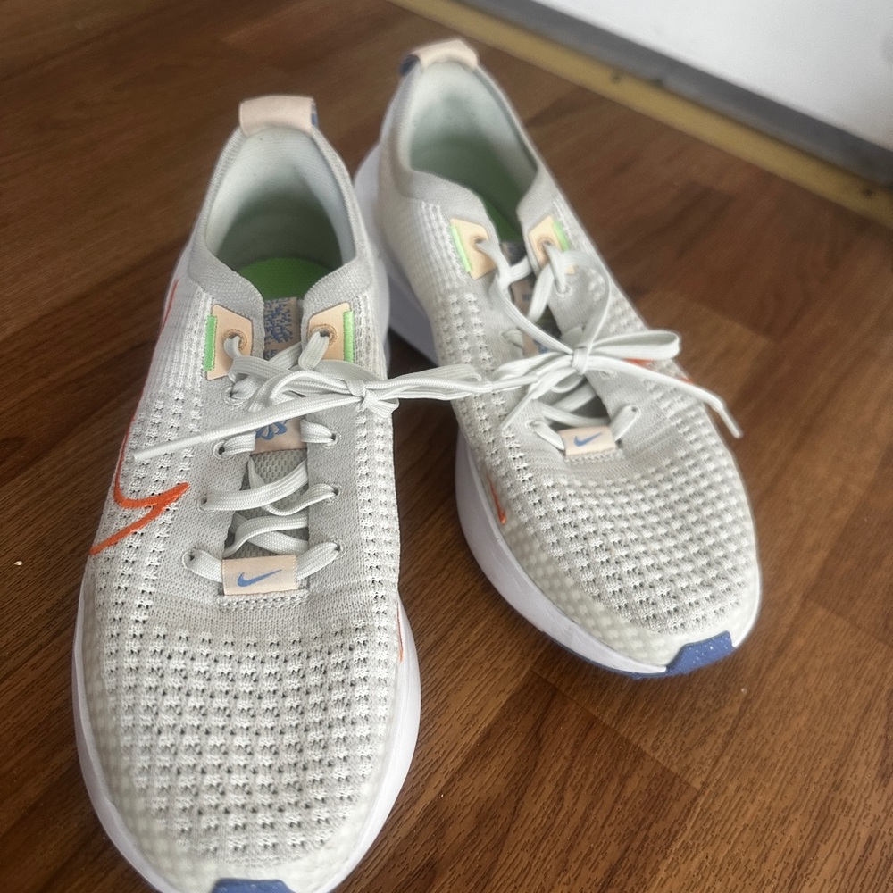 Nike Light Gray Knit Sneakers with Orange Swoosh and Pastel Accents